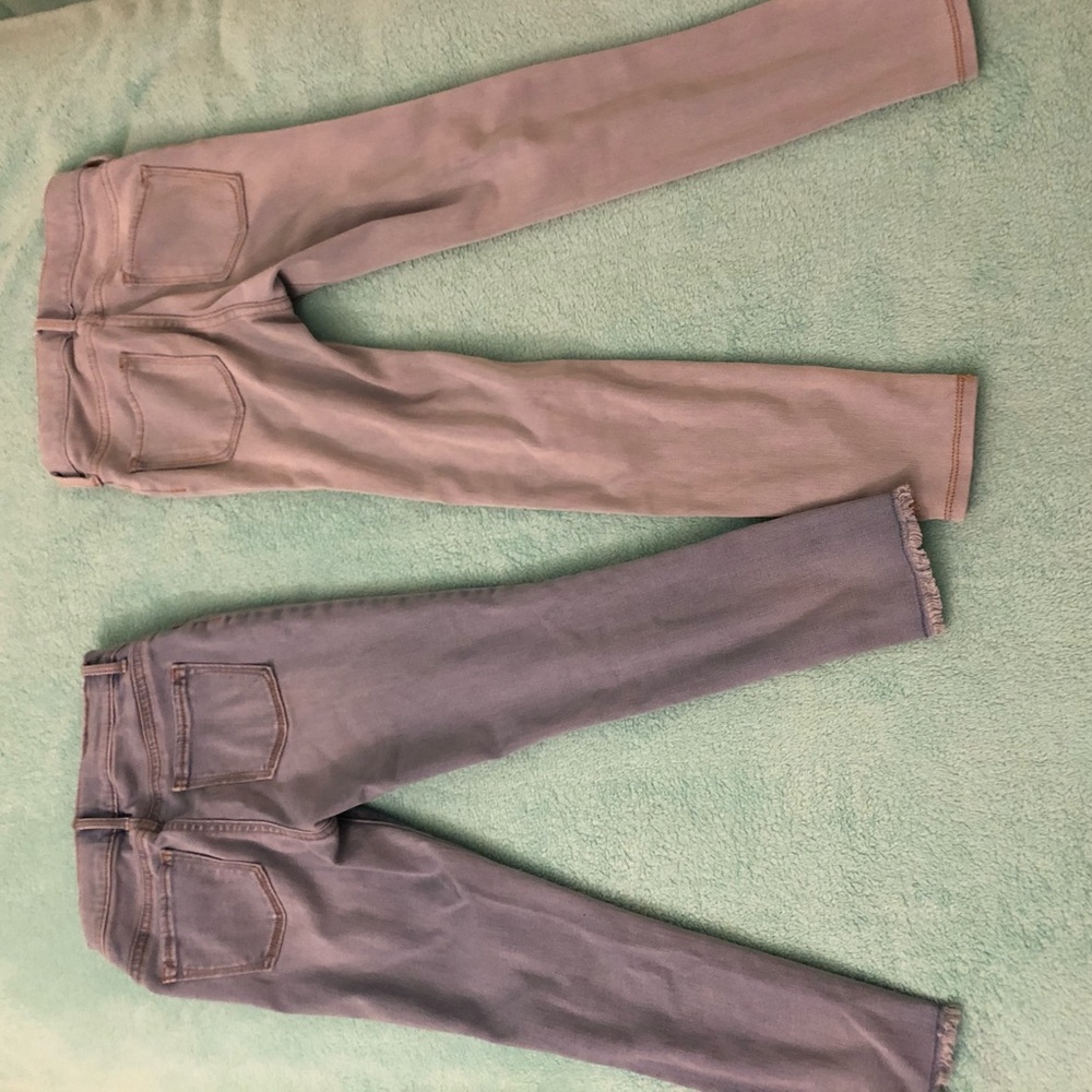 Two light wash jeggings.